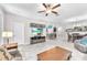 Open concept with a cozy living area featuring neutral paint, tile floors, and comfortable furniture at 13912 Painted Bunting Ln, Riverview, FL 33579