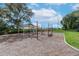 Community playground with a picnic table under a canopy for comfortable outdoor recreation at 13912 Painted Bunting Ln, Riverview, FL 33579