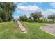 Community playground slide built into a grassy hill for safe and fun recreation at 13912 Painted Bunting Ln, Riverview, FL 33579