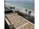 Aerial view of a beachfront patio with ocean views at 14950 Gulf Blvd # 603, Madeira Beach, FL 33708