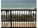 A view of the beach from a condo balcony with views of vegetation growing on the dunes at 14950 Gulf Blvd # 603, Madeira Beach, FL 33708