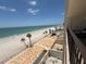 Beautiful beach view from a balcony with chairs and table at 14950 Gulf Blvd # 603, Madeira Beach, FL 33708