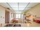 Well-lit kitchen with white appliances, lots of cabinet space, and a window view at 14950 Gulf Blvd # 603, Madeira Beach, FL 33708