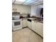 Kitchen with appliances and tile floor at 14950 Gulf Blvd # 603, Madeira Beach, FL 33708