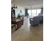 Inviting living room with large windows and tile flooring at 14950 Gulf Blvd # 603, Madeira Beach, FL 33708