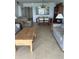 The expansive living area has tile floors, dining table, and comfortable seating with great natural light at 14950 Gulf Blvd # 603, Madeira Beach, FL 33708