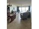 Bright living room with neutral colors, ocean view, and comfortable seating at 14950 Gulf Blvd # 603, Madeira Beach, FL 33708