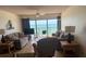 Cozy living room area with seating, TV, and ocean view at 14950 Gulf Blvd # 603, Madeira Beach, FL 33708