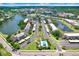 An aerial view of the condos showing lakes, lush landscaping, and a swimming pool for leisure and recreation at 172 Lakeview Way # 172, Oldsmar, FL 34677