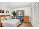 Well-lit bedroom with neutral tones, comfortable bedding, and a window offering natural light and view at 172 Lakeview Way # 172, Oldsmar, FL 34677
