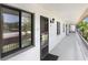 Inviting hallway featuring neutral colors, leading to residences with natural light, creating a serene and welcoming atmosphere at 172 Lakeview Way # 172, Oldsmar, FL 34677