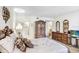 Tranquil bedroom with wood-look floors, a dresser with mirror, and a comfortable bed, creating a peaceful resting space at 172 Lakeview Way # 172, Oldsmar, FL 34677