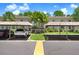 Community parking featuring covered spots, lush greenery and landscaping, and convenient access at 172 Lakeview Way # 172, Oldsmar, FL 34677