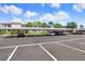 Community parking area with covered parking spaces and well-maintained landscaping at 172 Lakeview Way # 172, Oldsmar, FL 34677