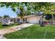 Charming single-story home with a well-manicured lawn and cozy curb appeal at 1720 Chrysler Ave, Sarasota, FL 34234