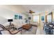 Cozy living room with a ceiling fan, sofas, rug, and artwork on the wall at 1720 Chrysler Ave, Sarasota, FL 34234