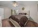 Inviting bedroom featuring a comfortable bed, ceiling fan, and soft, neutral decor at 18003 Arbor Crest Dr, Tampa, FL 33647
