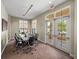 Conference room with large table, seating for ten, and plenty of natural light at 18003 Arbor Crest Dr, Tampa, FL 33647