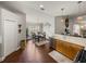 The dining area boasts wood floors, a chandelier, and seamless transition to the kitchen and living space at 18003 Arbor Crest Dr, Tampa, FL 33647