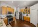 Well-lit kitchen with stainless steel appliances, wood cabinets, and an open layout for entertaining at 18003 Arbor Crest Dr, Tampa, FL 33647