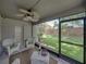 Relaxing screened-in lanai offering a peaceful view of the lush backyard at 18003 Arbor Crest Dr, Tampa, FL 33647