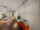 Bright and airy living room showcasing a decorative wall and hardwood floors at 18003 Arbor Crest Dr, Tampa, FL 33647