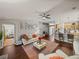 Open-concept living room boasts hardwood floors, modern furniture, and an inviting atmosphere with natural light at 18003 Arbor Crest Dr, Tampa, FL 33647
