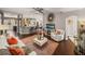 Spacious living area with seamless flow to kitchen, featuring modern decor and comfortable seating at 18003 Arbor Crest Dr, Tampa, FL 33647