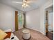 Bright living room with natural light and a white leather sofa at 18003 Arbor Crest Dr, Tampa, FL 33647