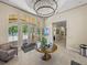 View of the community clubhouse lobby with tile flooring and a view of the outdoor pool at 18003 Arbor Crest Dr, Tampa, FL 33647