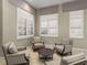 Cozy lounge area featuring comfortable seating and natural light through shuttered windows at 18003 Arbor Crest Dr, Tampa, FL 33647