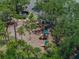 Aerial shot of the community playground, surrounded by lush tropical trees and shrubbery at 18003 Arbor Crest Dr, Tampa, FL 33647