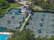 Numerous well-maintained tennis courts provide a premier athletic experience, surrounded by lush landscapes and community amenities at 18003 Arbor Crest Dr, Tampa, FL 33647
