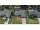 Bird's eye view of a home in a residential neighborhood with a private fenced-in swimming pool at 1801 Sagebrush Rd, Plant City, FL 33566