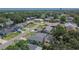 High angle view of a home with a screened-in pool, a backyard, and manicured landscaping at 1801 Sagebrush Rd, Plant City, FL 33566