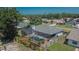 Aerial shot of a screened-in pool area in the backyard, enhanced by lush landscaping and privacy fencing at 1801 Sagebrush Rd, Plant City, FL 33566
