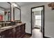 Bathroom features a double sink vanity, granite counters, and a connecting water closet at 1801 Sagebrush Rd, Plant City, FL 33566