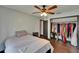 Bright bedroom features a ceiling fan, closet and ensuite bathroom at 1801 Sagebrush Rd, Plant City, FL 33566