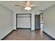 Bedroom features an empty closet with a clothing rod, and wood look floors at 1801 Sagebrush Rd, Plant City, FL 33566