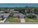Inviting single-story home with a well-manicured lawn and landscaping, complemented by a paved driveway at 1801 Sagebrush Rd, Plant City, FL 33566