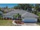 Charming single-story home featuring well-maintained landscaping and a welcoming two-car garage at 1801 Sagebrush Rd, Plant City, FL 33566