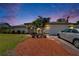 Charming single-story home with a well-kept lawn, colorful plantings, and a paved driveway at 1801 Sagebrush Rd, Plant City, FL 33566