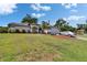 Lovely single-story home with a well-manicured lawn, charming landscaping, and a paved driveway at 1801 Sagebrush Rd, Plant City, FL 33566