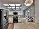 Modern kitchen with stainless steel appliances and granite countertops at 1801 Sagebrush Rd, Plant City, FL 33566