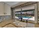 Stylish kitchen with granite counters, pool view, and stainless steel appliances at 1801 Sagebrush Rd, Plant City, FL 33566
