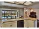 Bright kitchen with granite counters, pool view, and stainless steel appliances at 1801 Sagebrush Rd, Plant City, FL 33566