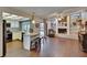 Open-concept kitchen, fireplace, wood floors, and pool views enhance this home at 1801 Sagebrush Rd, Plant City, FL 33566