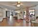 Open-concept living space with kitchen, wood floors, and access to pool at 1801 Sagebrush Rd, Plant City, FL 33566