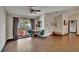 Cozy living room with tile floors, a round table with chairs, and a bright window at 1801 Sagebrush Rd, Plant City, FL 33566