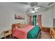 Bright main bedroom features ceiling fan, and sliding glass doors at 1801 Sagebrush Rd, Plant City, FL 33566